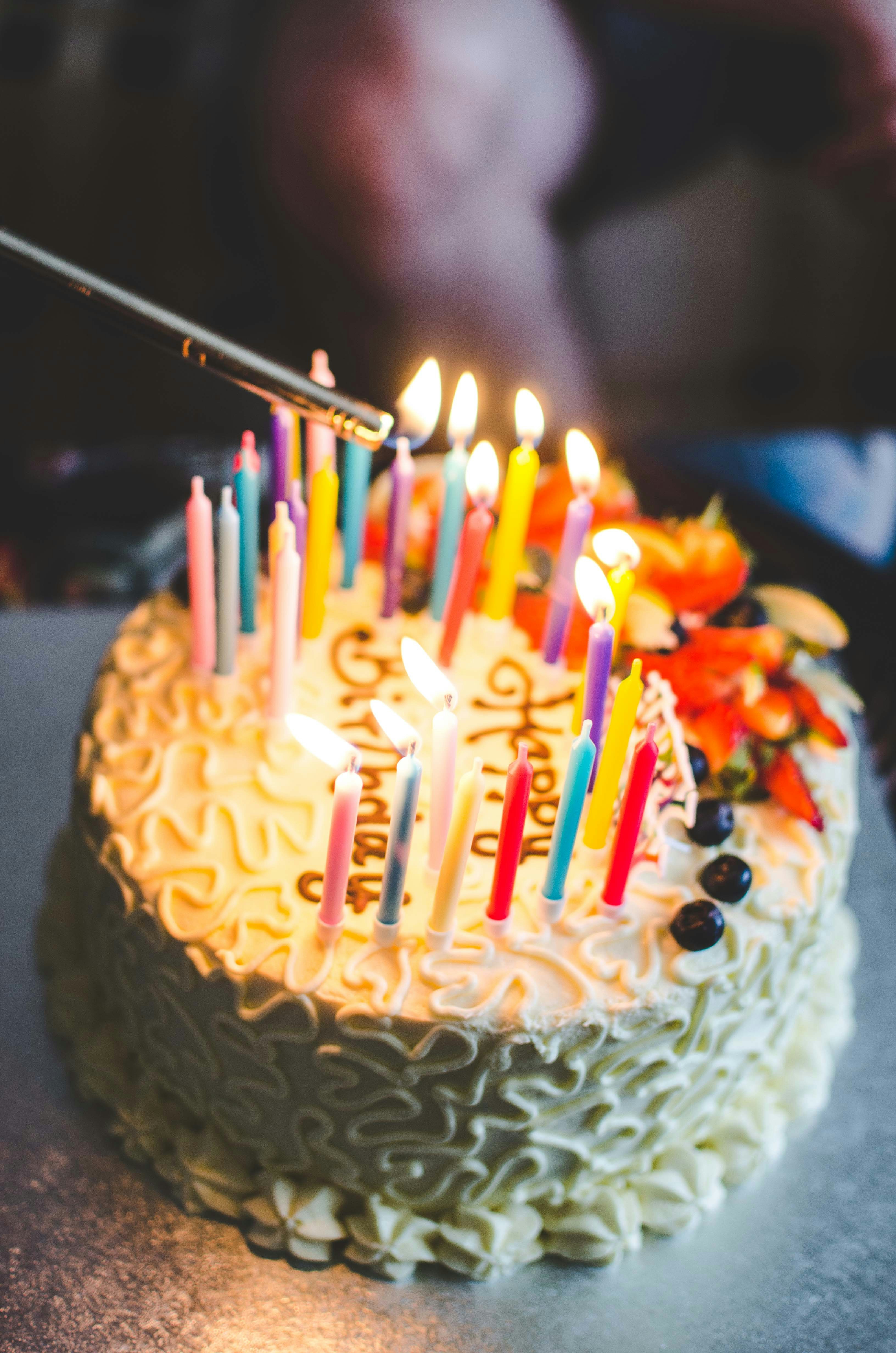 Birthday cake with lit candles for birthday painting events